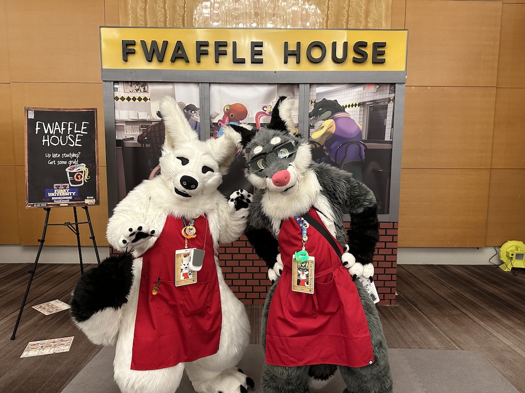 illustration of two foxes wearing red aprons carrying books