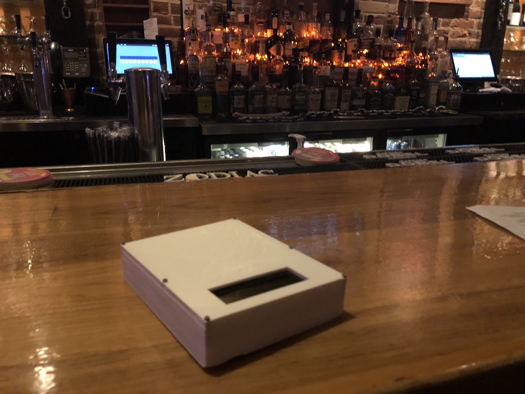 The Device sitting at the bar